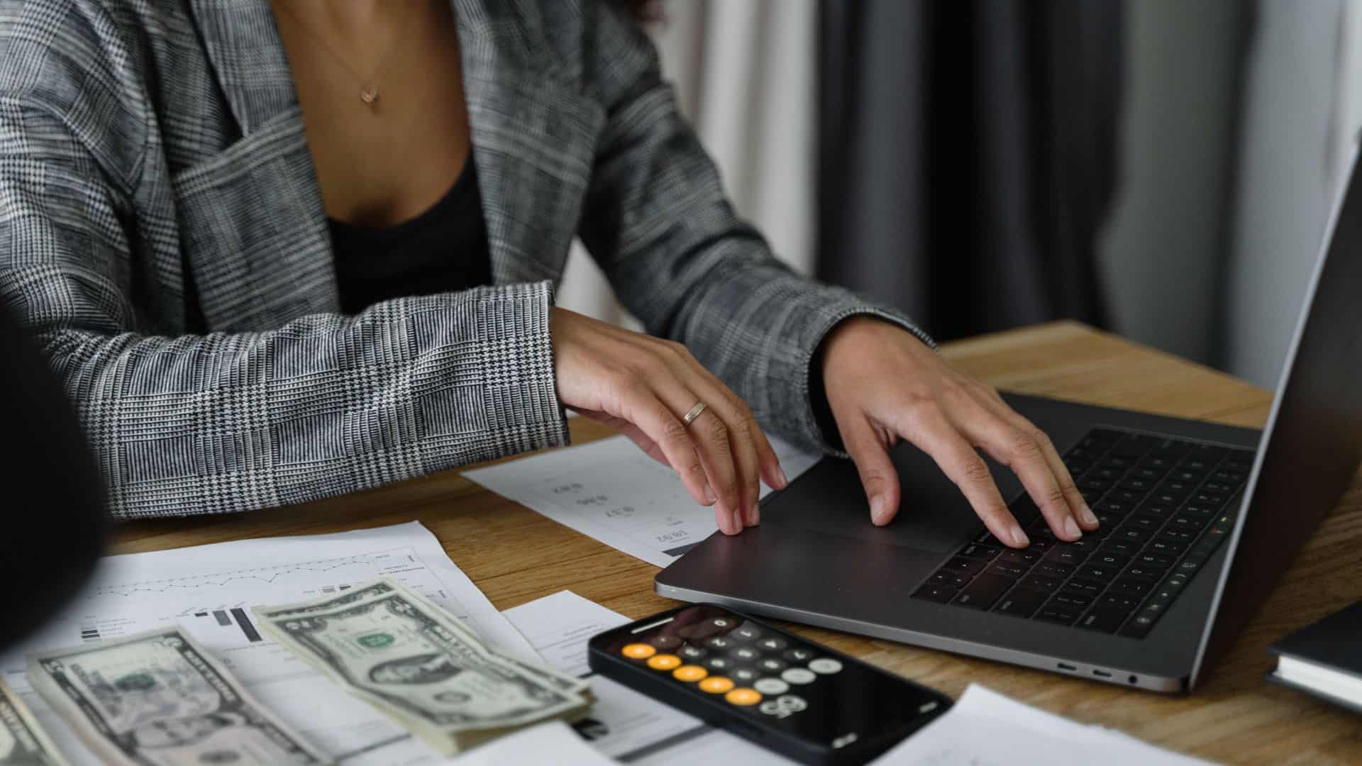 a woman computing payroll