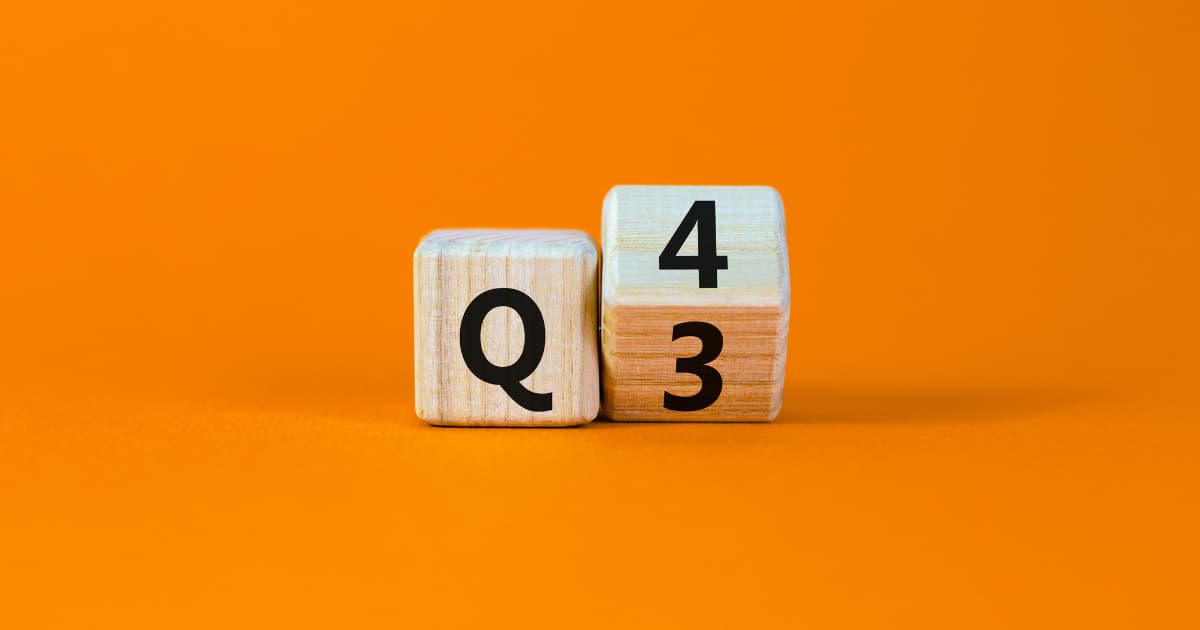 Wooden blocks showing a Q next to stacked blocks with the numbers 4 and 3 on an orange background.