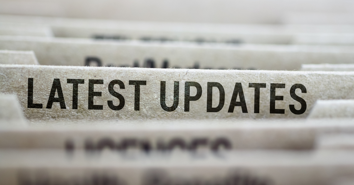 9 Close-up of a filing tab labeled 'LATEST UPDATES' among folder dividers.